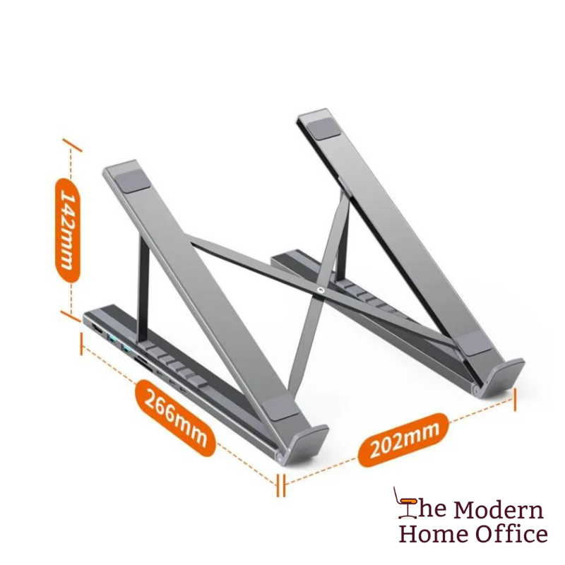 Elevate your laptop experience with our Aluminum Laptop Stand featuring an integrated USB hub. Engineered for ergonomic comfort and convenience, this stand raises your laptop to eye level, reducing strain on your neck and shoulders during extended use. With built-in USB ports, it provides easy access to additional connectivity options, allowing you to connect peripherals and accessories with ease. -The Modern Home Office