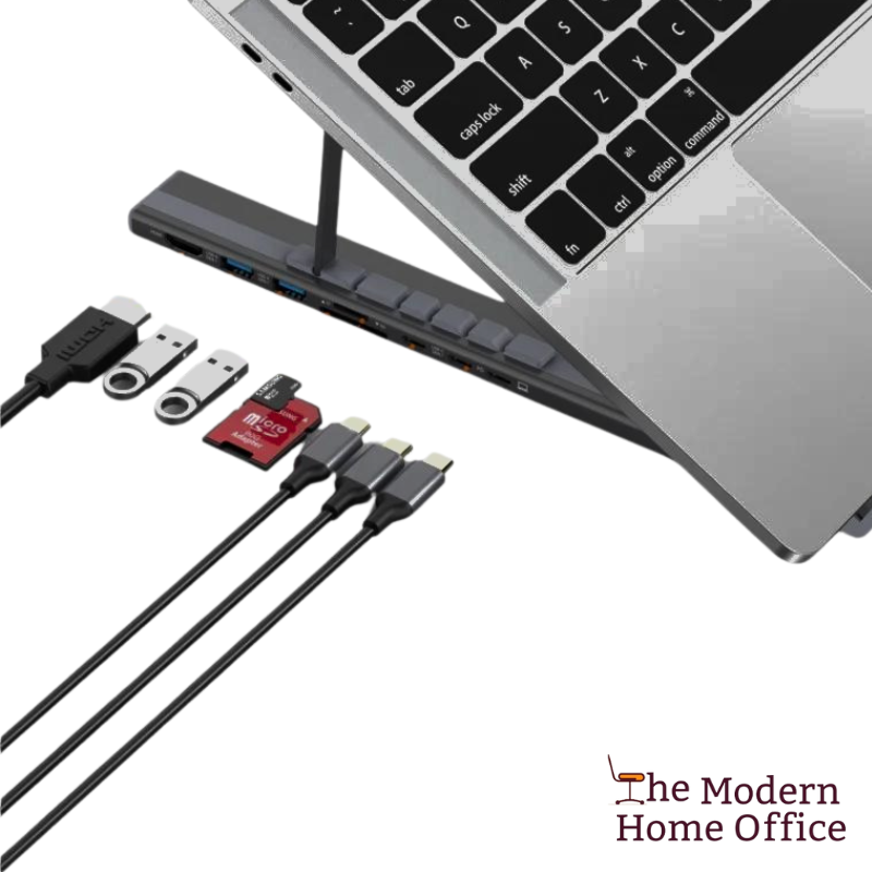 Elevate your laptop experience with our Aluminum Laptop Stand featuring an integrated USB hub. Engineered for ergonomic comfort and convenience, this stand raises your laptop to eye level, reducing strain on your neck and shoulders during extended use. With built-in USB ports, it provides easy access to additional connectivity options, allowing you to connect peripherals and accessories with ease. -The Modern Home Office